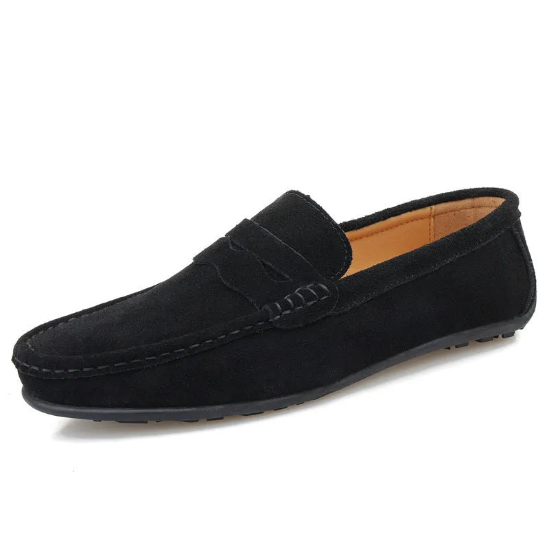 Men's solid colour suede loafers with round toe and flat rubber sole.