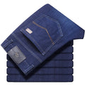 Stretch jeans in black and blue denim with straight-leg fit and high elasticity fabric
