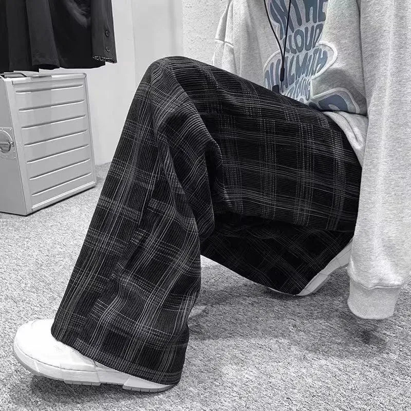 Men's black and green plaid pattern loose-fit straight-leg casual trousers on mid-waist