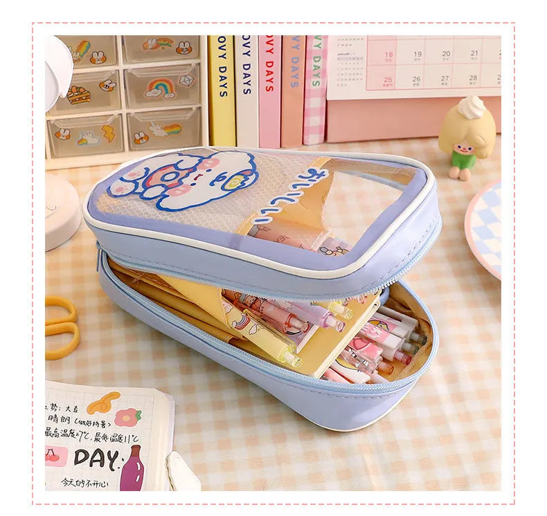 Transparent PVC pencil case with cartoon design options including caramel bear, pink floral rabbit, and water blue happy dog patterns