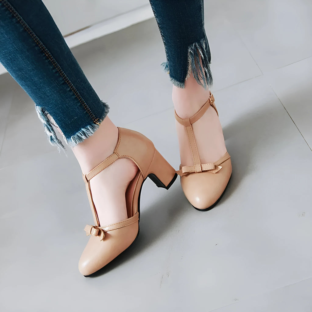 Women's chunky heel sandals with bow tie design and adjustable buckle strap in apricot colour