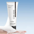White bottle of whitening and freckle removing facial cleanser, 100ml.