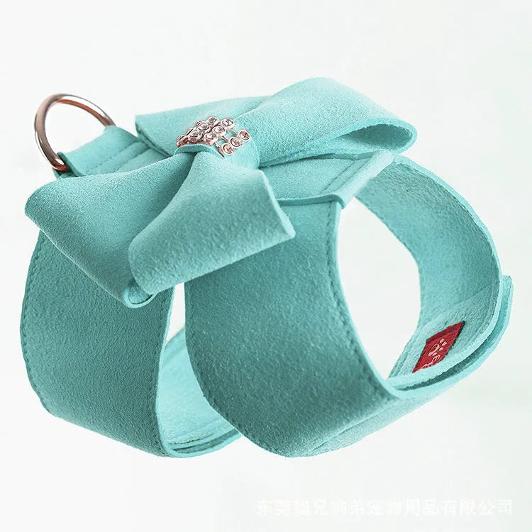 Cute pink microfiber dog chest strap harness with a large bowknot decoration and a metal D-ring.