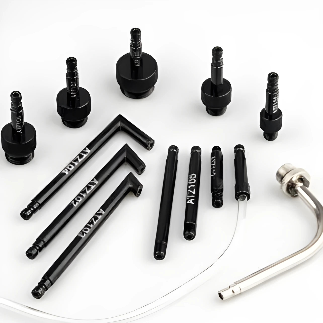 13-piece automatic transmission oil refuelling kit with hand pump and assorted connectors on a white background.