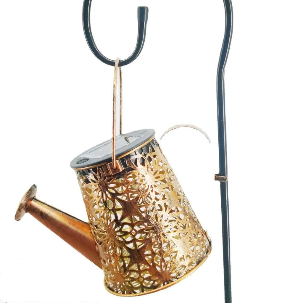 Solar-powered wrought iron butterfly kettle light for outdoor garden decoration.