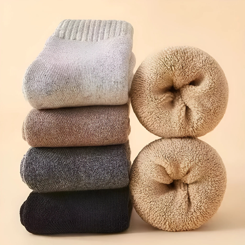 Two pairs of thick solid-colour winter wool socks with a merino wool midsole.