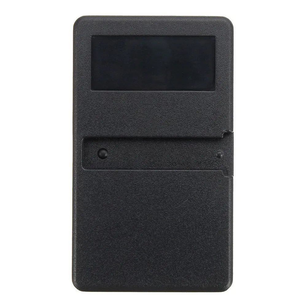 Black three-button garage door remote control with keyring loop next to a CR2032 battery.