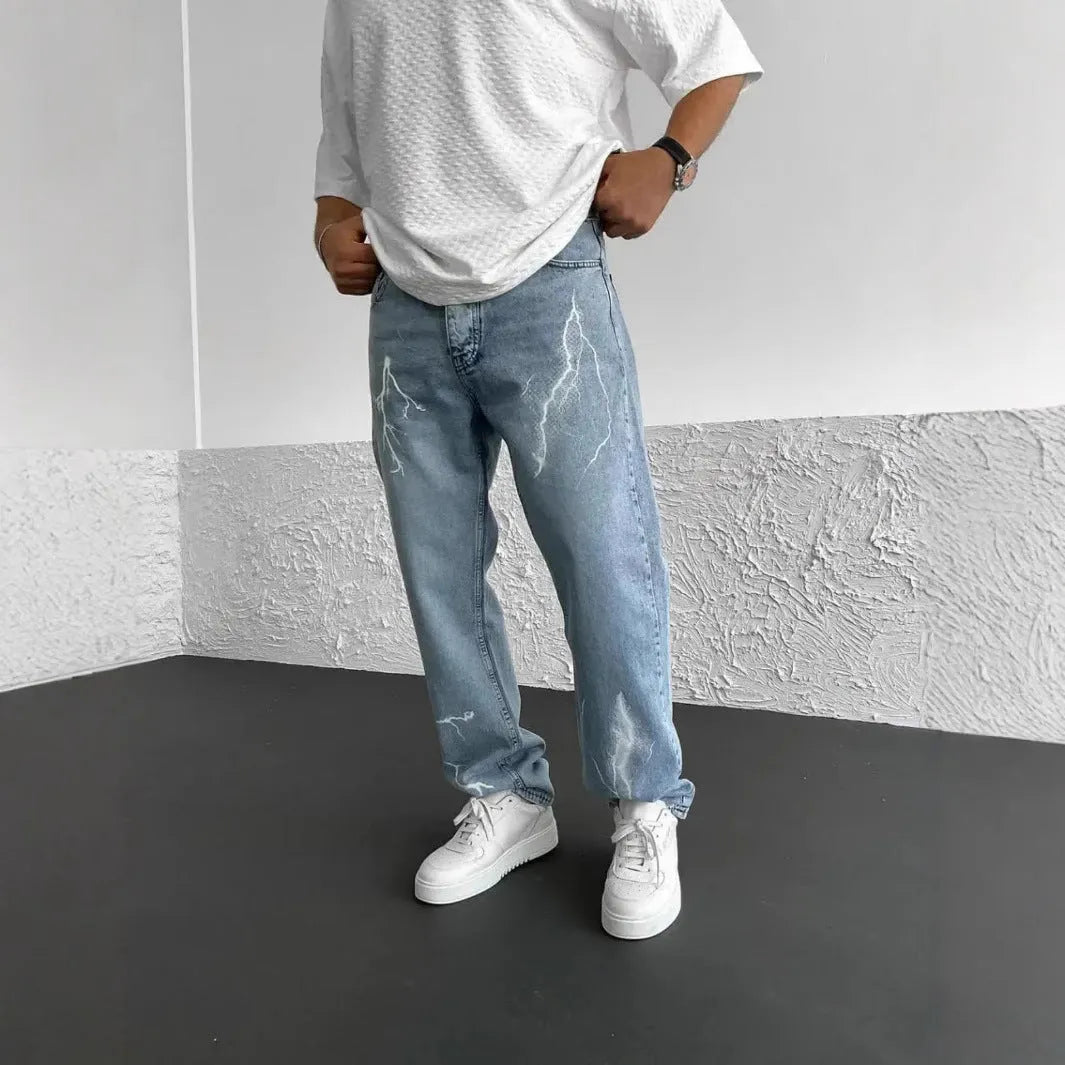 Blue men's straight-leg denim jeans with a loose wide-leg fit and mid-rise waist.
