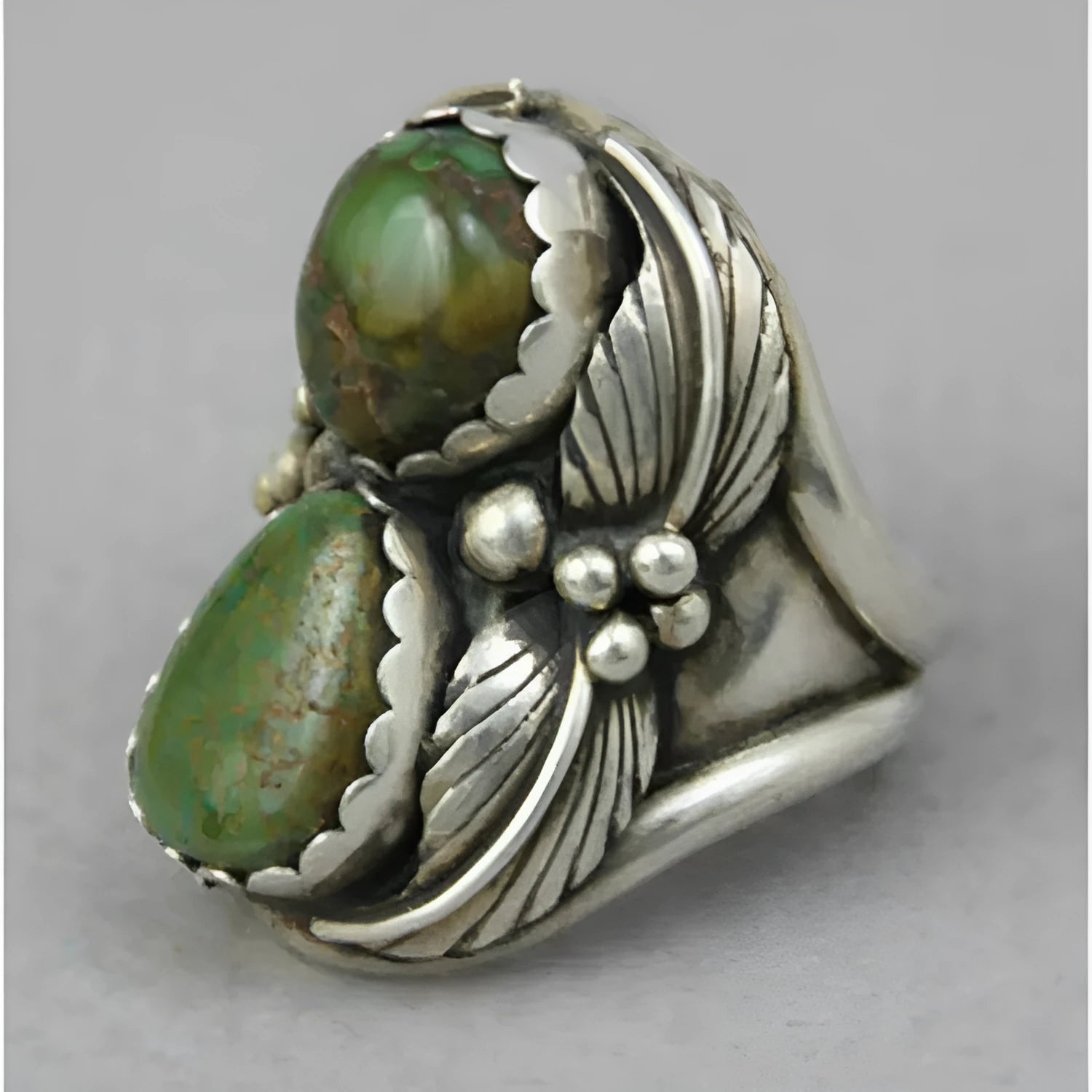 Women's turquoise geometric alloy ring with inlaid retro design, shown on a finger.