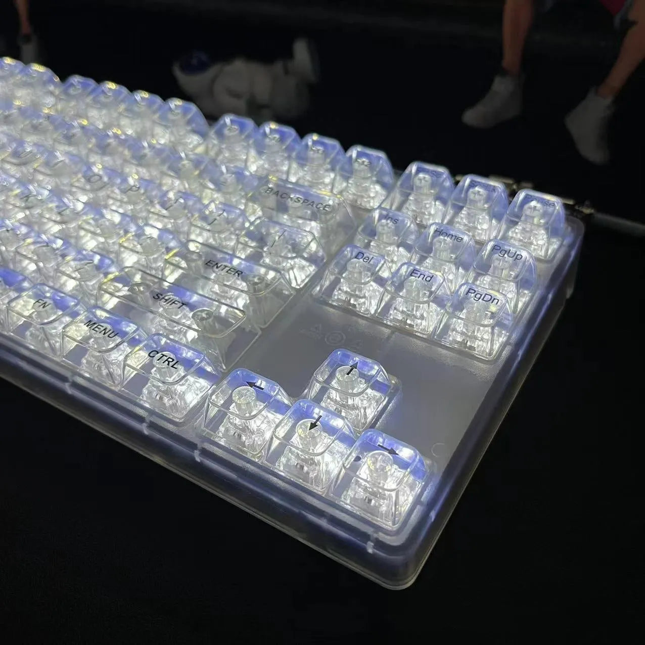 Universal transparent plastic 132-key mechanical keyboard key cap set laid out.