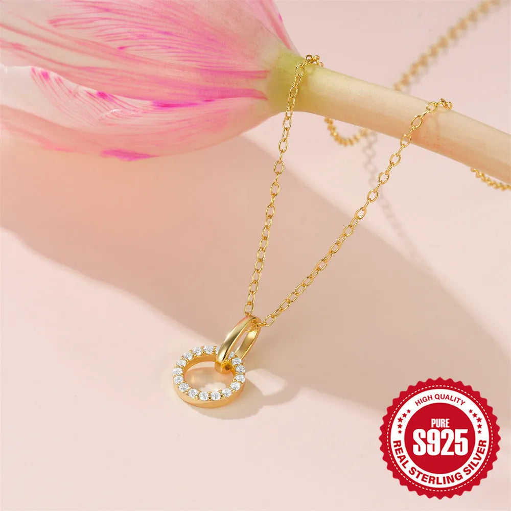 Gold-coloured S925 sterling silver geometric pendant necklace on a model, showing adjustable clasp.