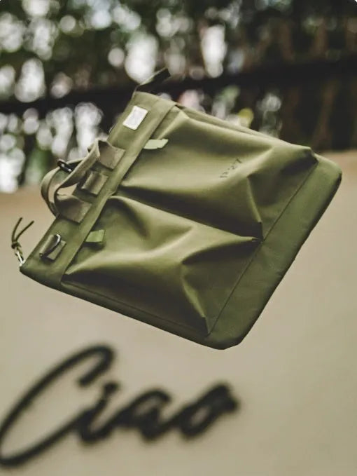 Canvas messenger crossbody bag in charcoal black with shoulder strap and hard handle
