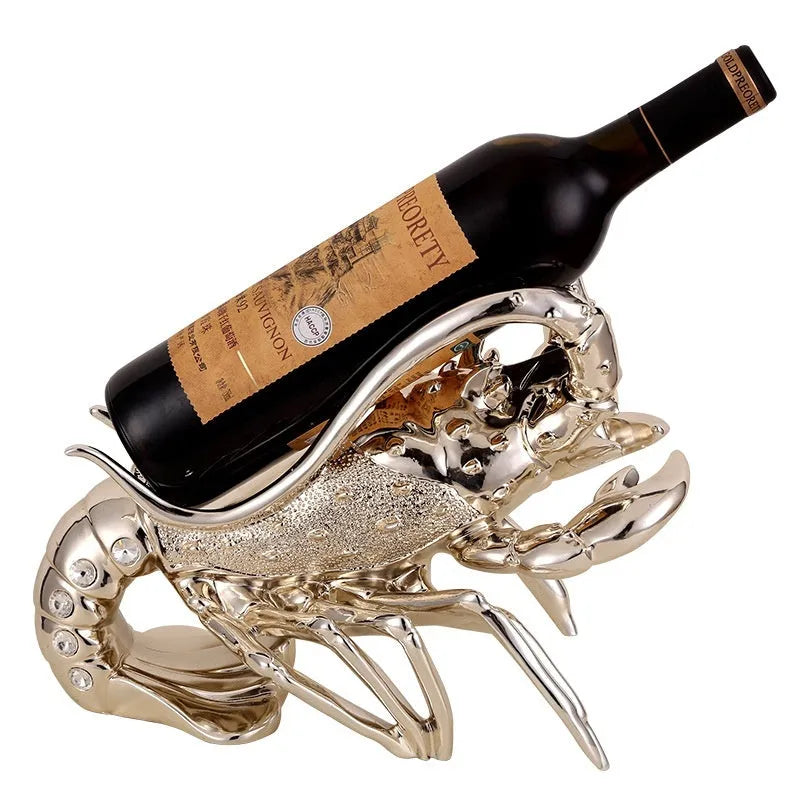 Metallic rose gold lobster-shaped resin ornament holding a wine bottle.