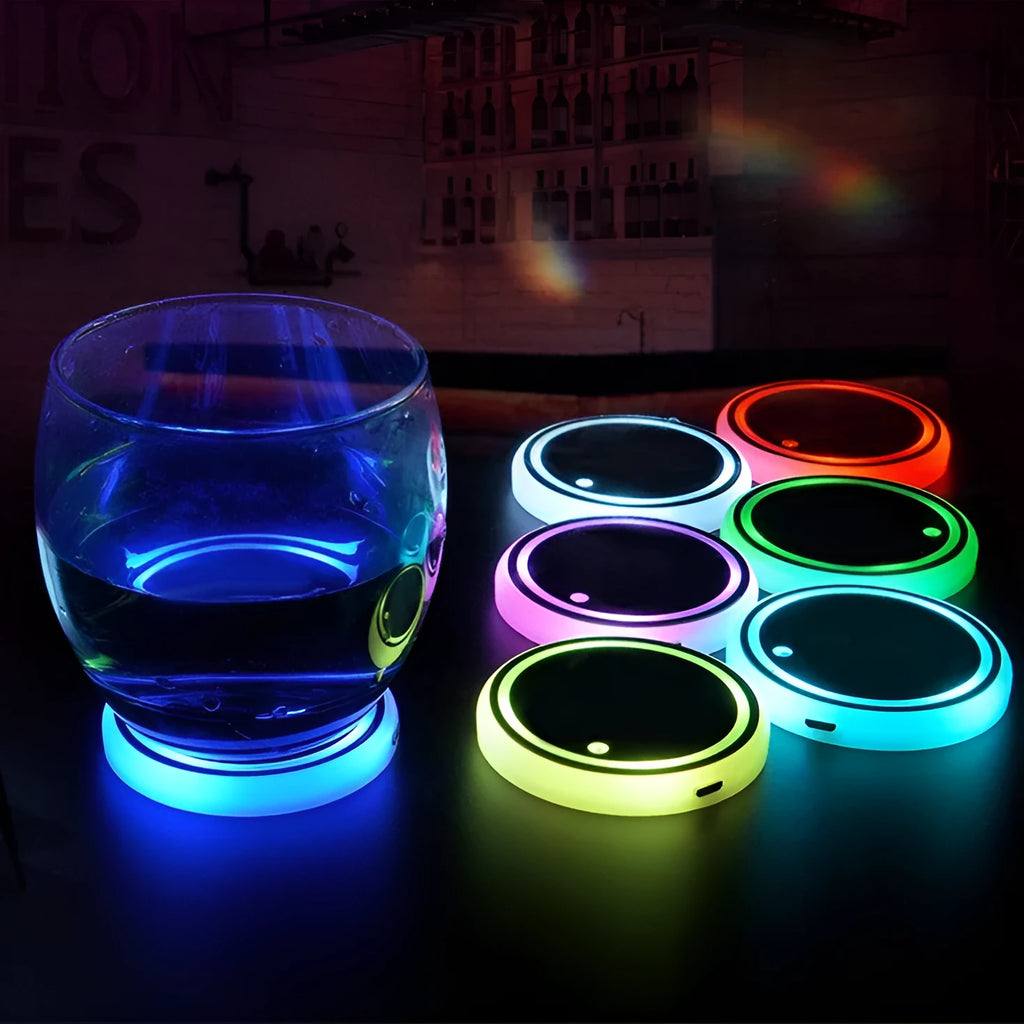 Colourful LED light-up coaster for car cup holder showing seven changeable colours and USB cable.