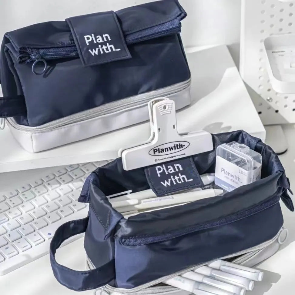 Polyester student pencil case showing double-layer design in dark blue, blue, and cream white colour options