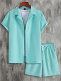Man wearing a white short sleeve Cuban collar shirt and matching shorts from a lightweight polyester sport suit.