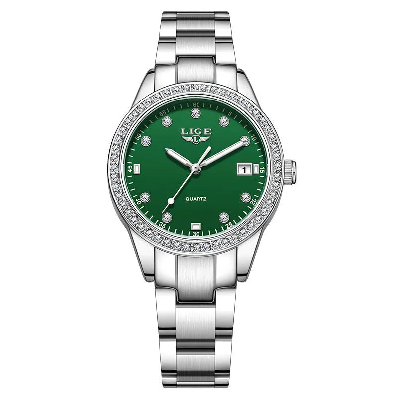Silver fashion quartz watch for women with diamond-encrusted bezel and luminous dial on a 34mm stainless steel case.