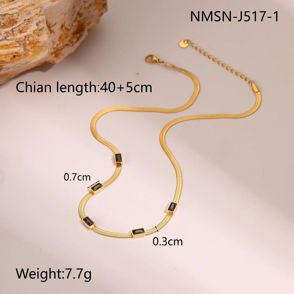 Geometric square zircon pendant on a stainless steel flat snake chain necklace.