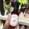 Pomegranate skincare set showing six bottles: cleanser, water, milk, essence, cream, and eye cream.