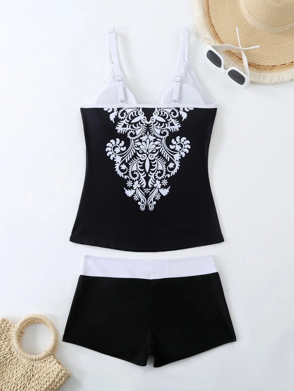 Women's plus size swimsuit set with matching swimming trunks in black or rose red printed design