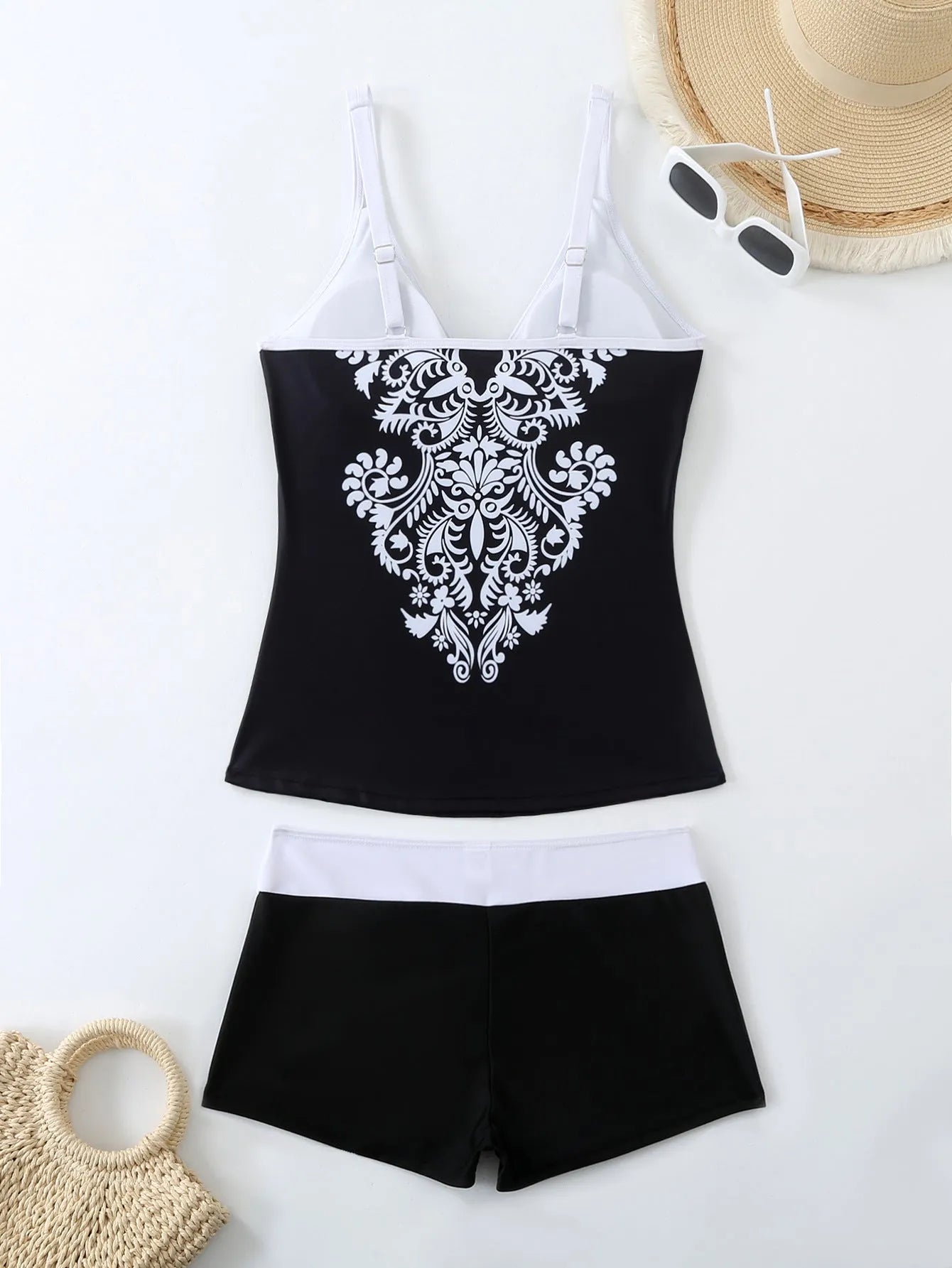 Women's plus size swimsuit set with matching swimming trunks in black or rose red printed design