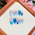 Blue hand-painted carved fake nails on transparent base with four size options