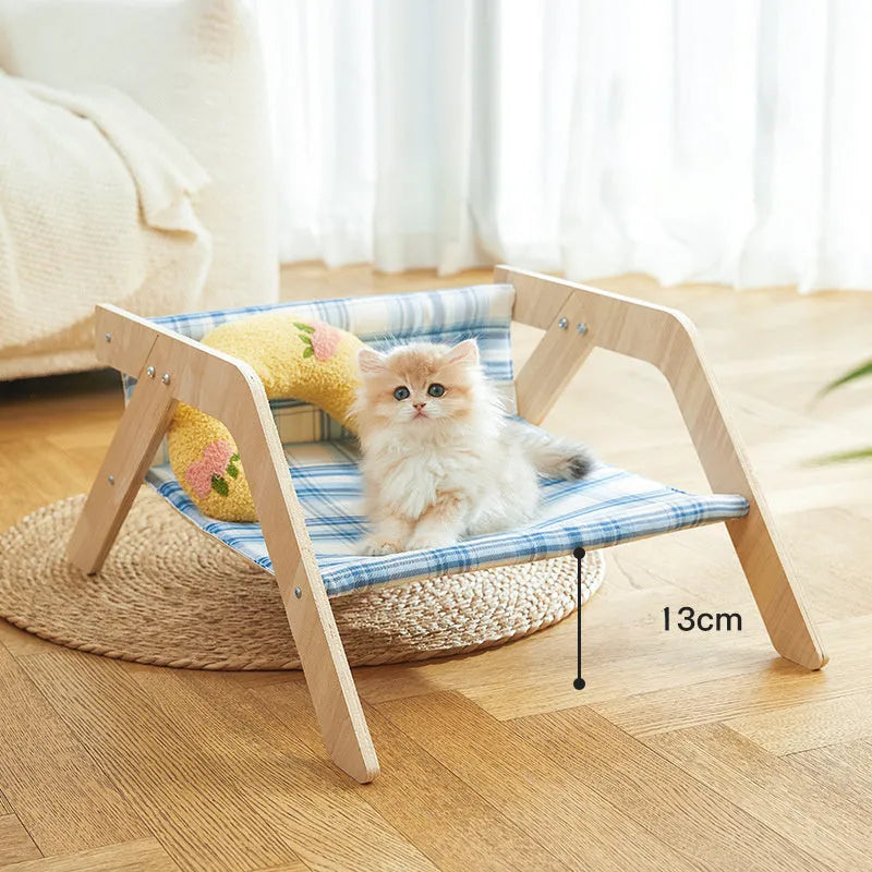 Wooden frame elevated cat bed with cloth hammock in beach chair design for indoor cats