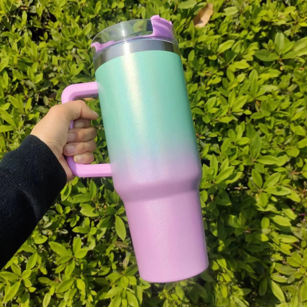 Large stainless steel vacuum insulation cup with gradient colour finish showing double-layer construction