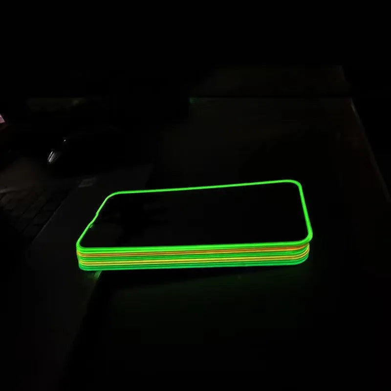 Fluorescent luminous tempered glass screen protector for iPhone on a phone.