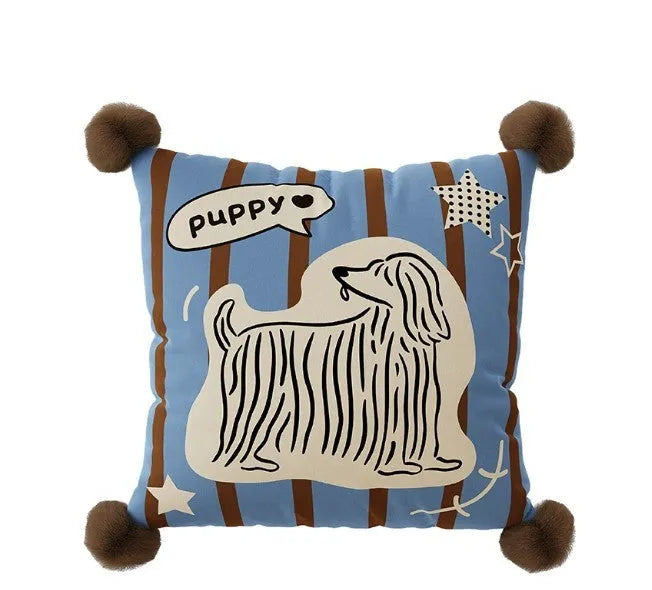 Blue cartoon animal print cushion pillow with removable cover on a grey sofa.