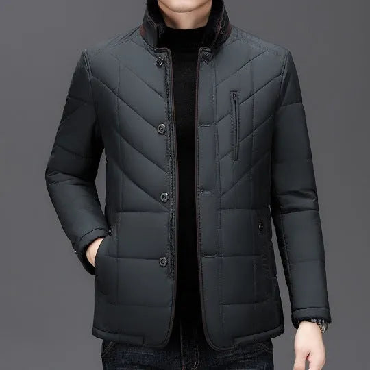Men's solid colour winter padded coat in dark blue, shown with side seam pockets.