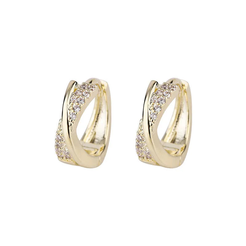 Geometric copper earrings with 14K yellow zircon finishing, showing architectural jewellery design