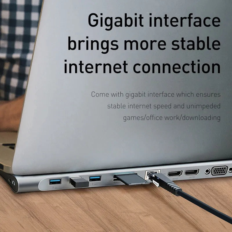 Grey aluminium alloy ten port docking station with integrated laptop cooling bracket showing HDMI, VGA, and USB ports