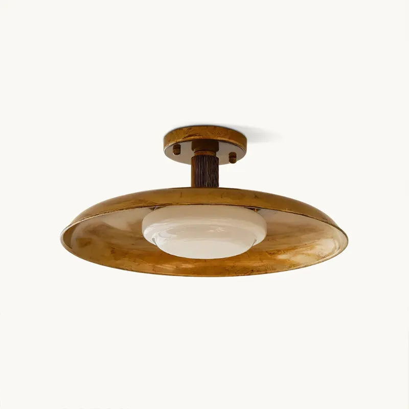 American retro alloy ceiling lamp in copper finish mounted on a ceiling.
