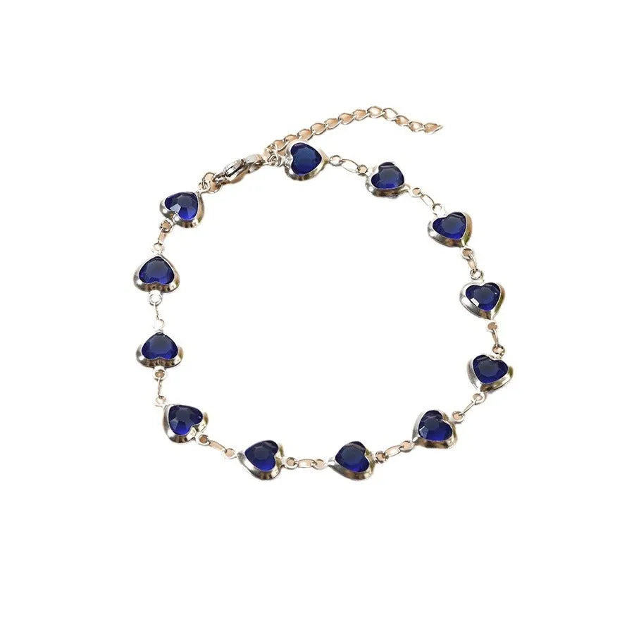 Devil's Eye geometric heart-shaped stainless steel bracelet in one of six colour options on a wrist.