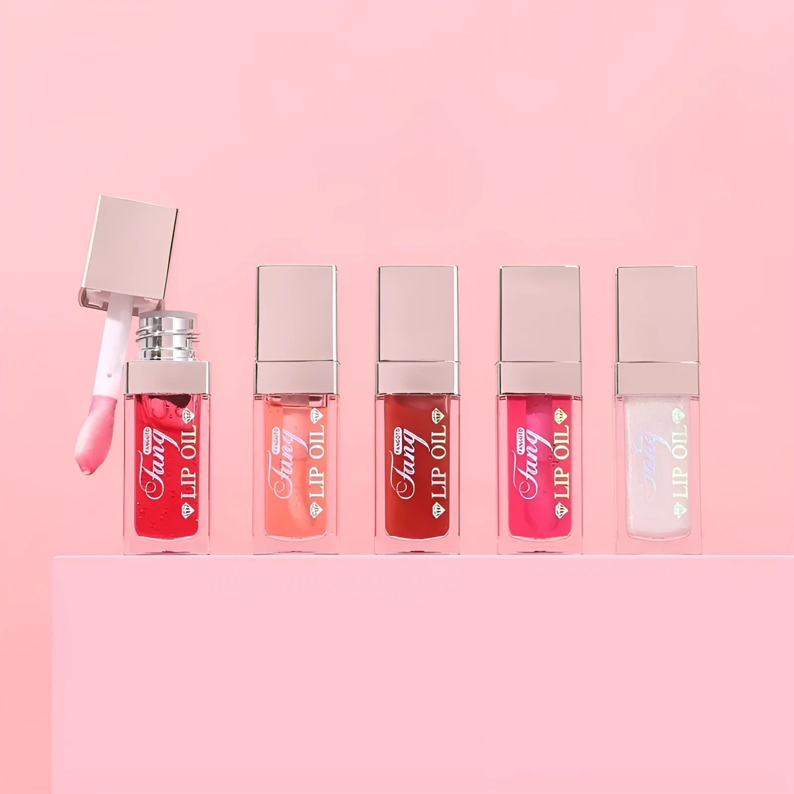 Mint lipstick set with five colour shades and a lip essence oil bottle.