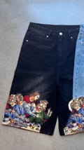 Blue men's cotton shorts with a Jesus design printed on the back pocket, showing tapered leg.
