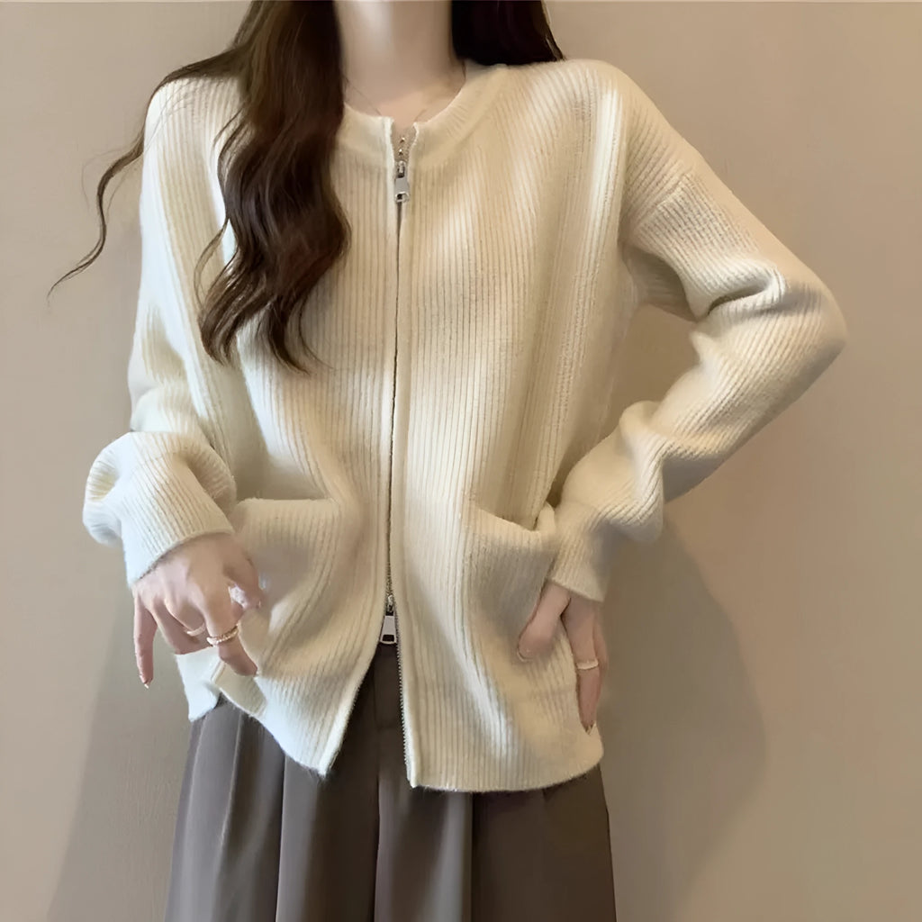 Beige women's soft viscose sweater coat cardigan with long sleeves on a hanger.