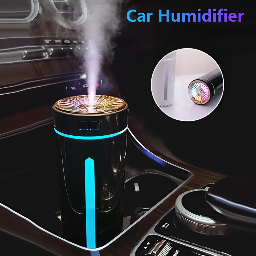 Black portable car humidifier with colourful LED lights showing mist output, placed in vehicle cup holder