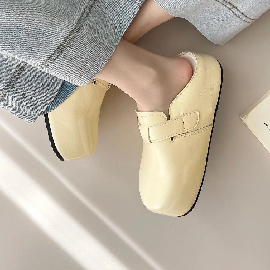 Flat buckle casual sneakers in creamy-white with round toe and PU leather upper.