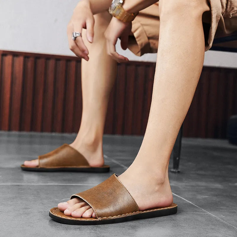 Men's brown leather sandals with adjustable straps and a rubber sole for outdoor casual wear.
