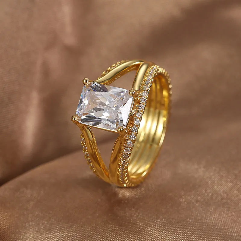 Gold geometric women's ring with zircon stones showing side and top view