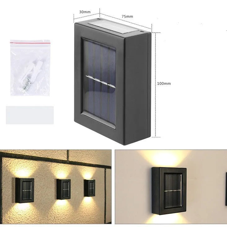 Small black solar garden wall light with LED illumination for outdoor decorative lighting
