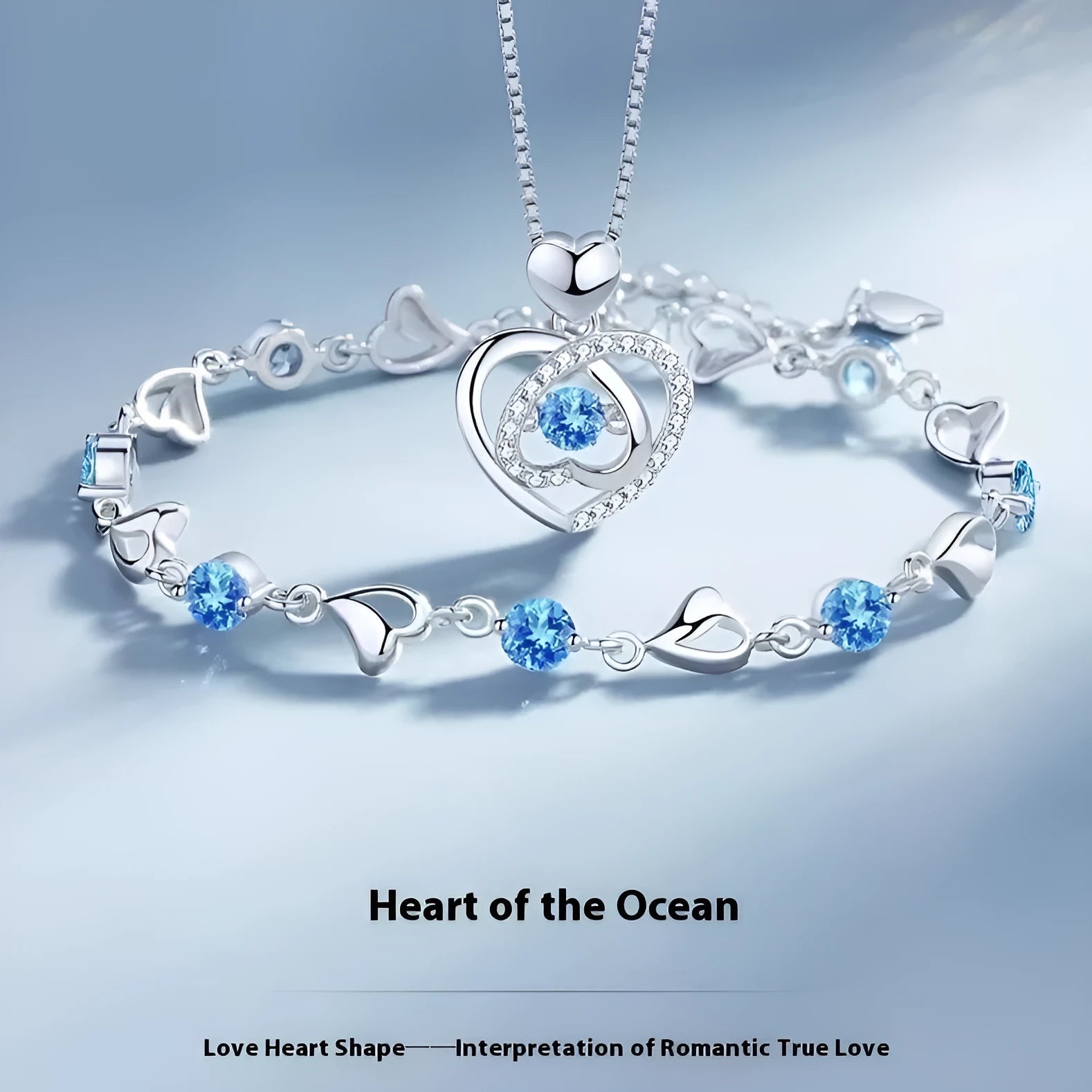 Blue diamond electroplated heart jewellery set with geometric pendant necklace and matching bracelet