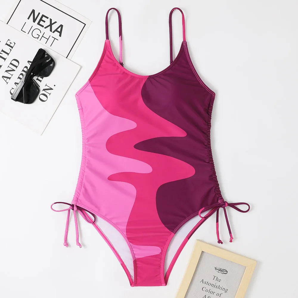 Women's sleeveless one-piece swimsuit in blue, purple, brown, or green colours with striped or solid patterns
