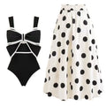Women's black one-piece swimsuit with a white round skirt and bow detail on the front.