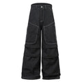 Black multi-pocket pleated workwear jeans made from cotton denim on a plain background.