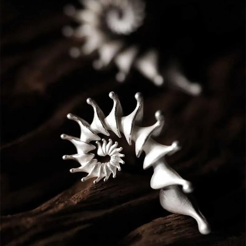 Exaggerated three-dimensional conch shell design matte earrings in alloy with electroplated finish