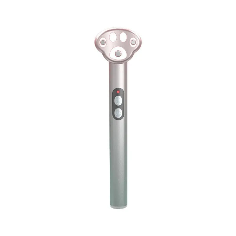 Gradient pink cats paw shaped micro-current eye massager on a white background