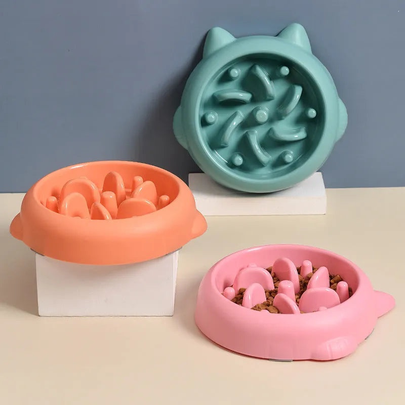 Green bone-shaped slow feeder bowl for dogs to prevent fast eating and choking.
